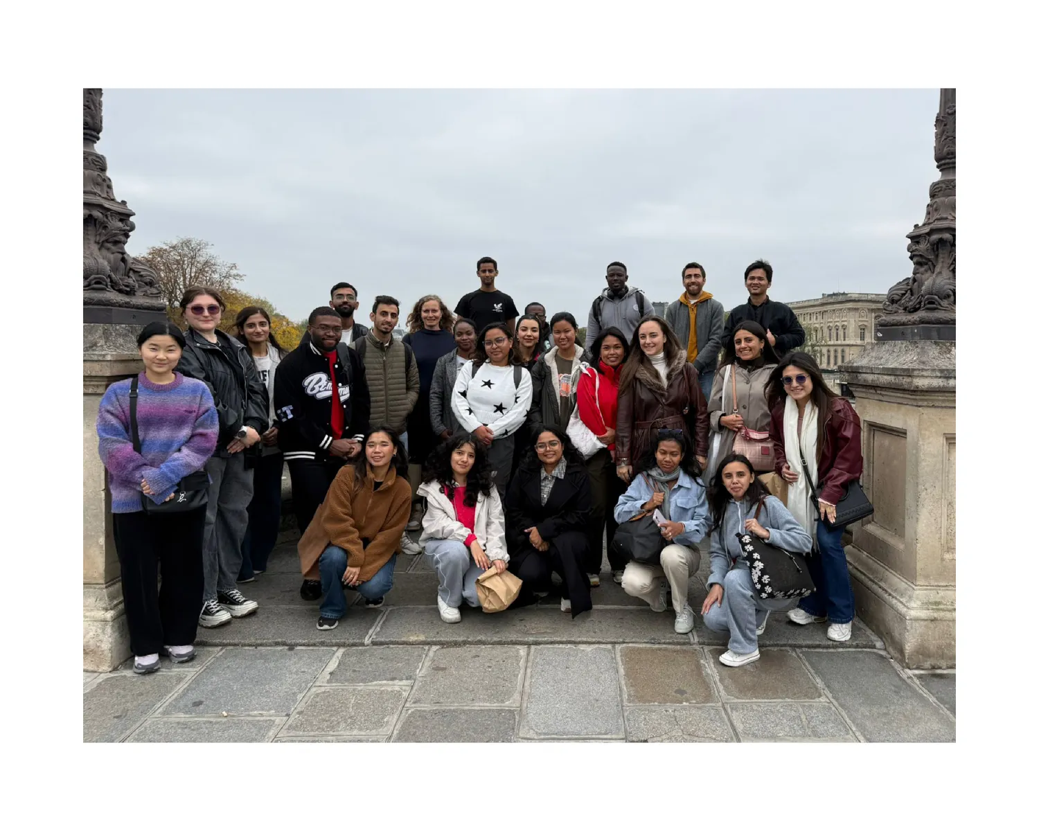 Large group photo with CNAM classmates on a Paris bridge