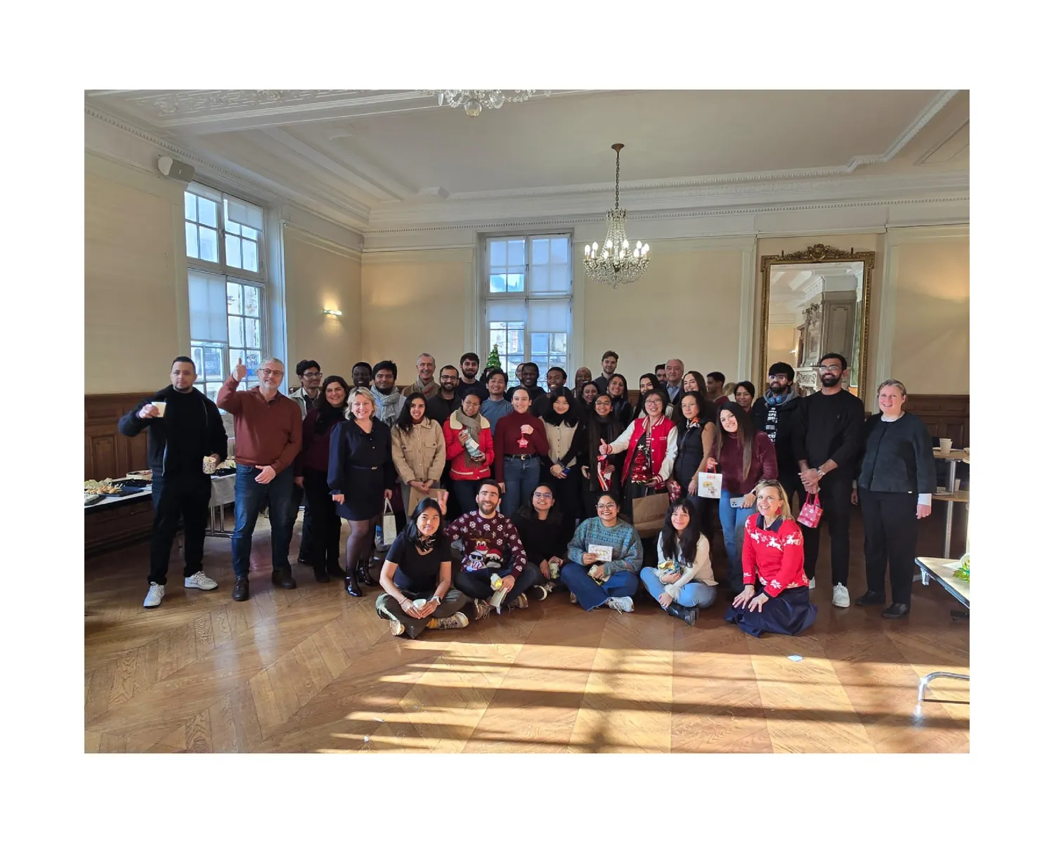 Holiday gathering with CNAM classmates in a decorated hall
