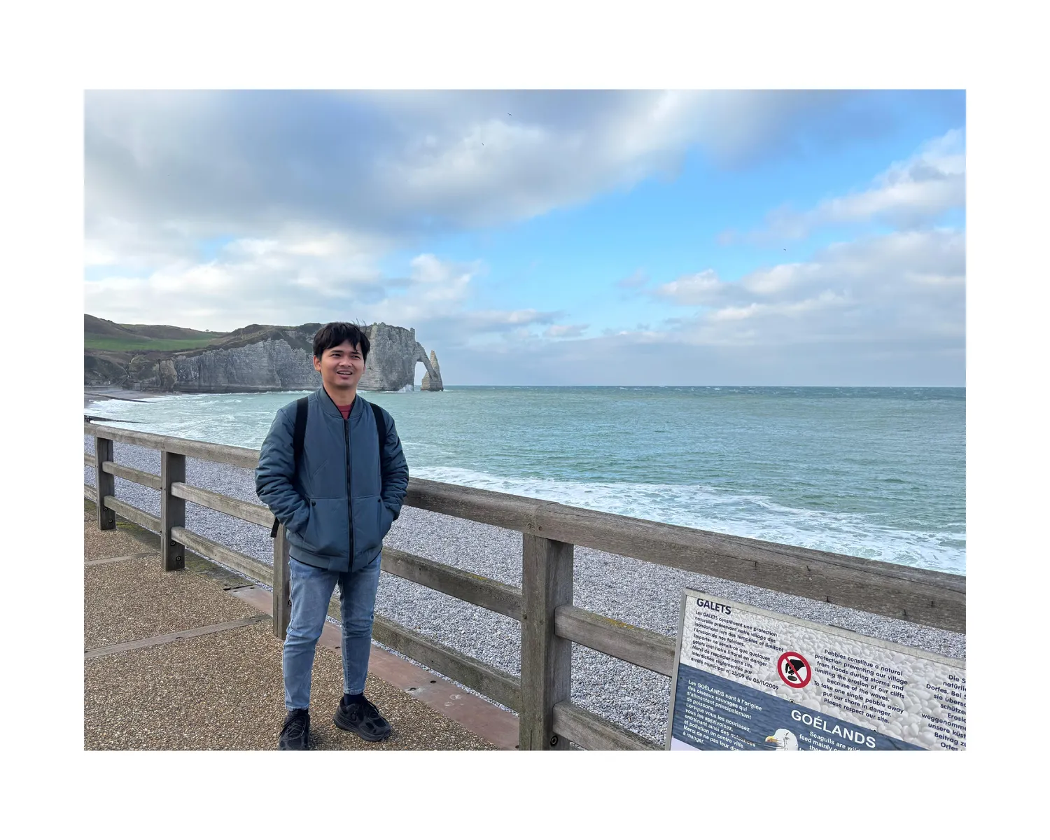 Standing by the cliffs at Étretat on the Normandy coast